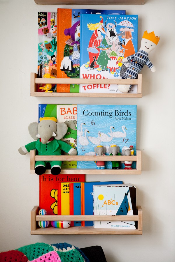 Children's book shelf using IKEA spice racks via we-are-scout.com