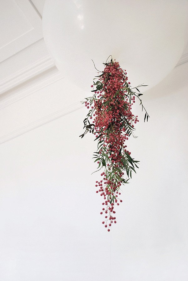 Decorate an oversized balloon with fresh trailing flowers for an instant wow table centrepice, via We-Are-Scout.com. 