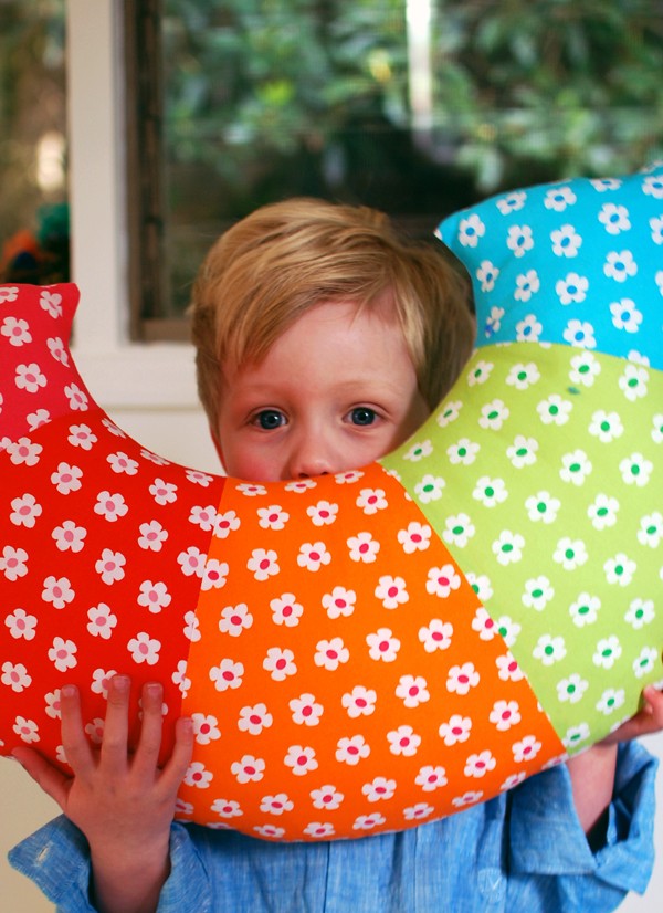 Sew a bright ranbow pillow - tutorial via We Are Scout