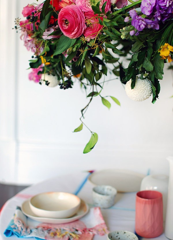 Tableware and vessels all Lisa's own: Fold Unfold tablecloth by HAY; Tea towels used as napery by Mark Tuckey for Cotton On; Speckled vessels by Katia Carletti; Lisa’s mum’s white vintage glass vases; pink vessel by the Mod Collective; ceramic plates and bowls by Kim Wallace.