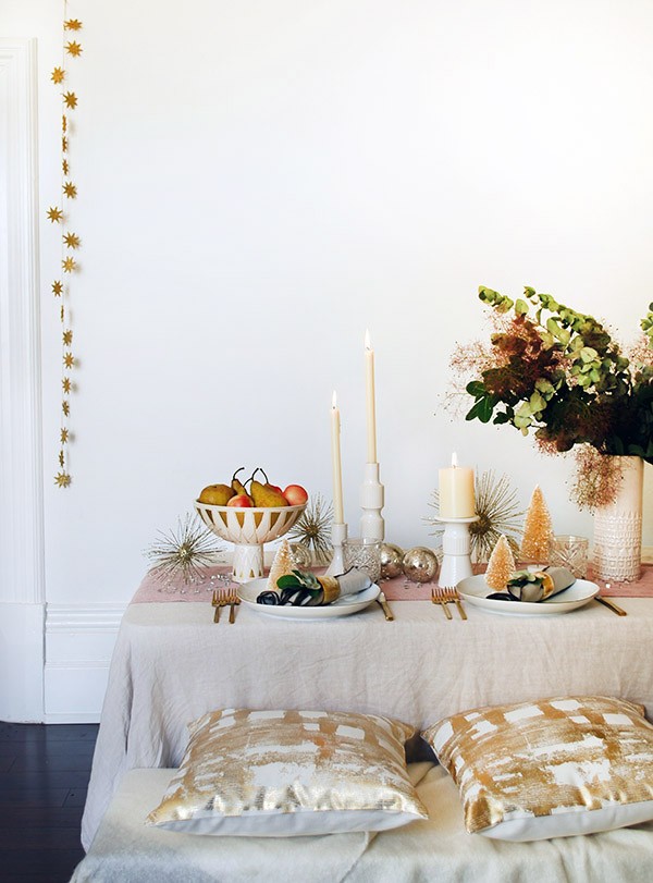 Create a mid-century inspired, soft rose gold Christmas table with West Elm. Get the how-to and top tips at We Are Scout. Photo by Lisa Tilse for We Are Scout. 