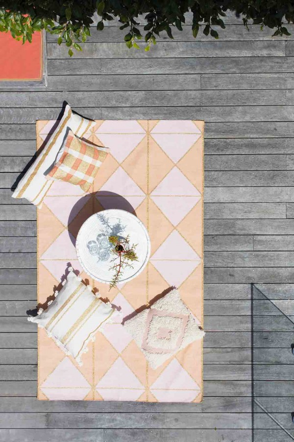 Langdon LTD - Australian homewares. Peach and pink rug with gold stripes.