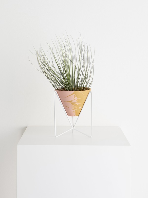 Individually crafted resin pot and modernist-inspired wire plant stand by Capra Designs.