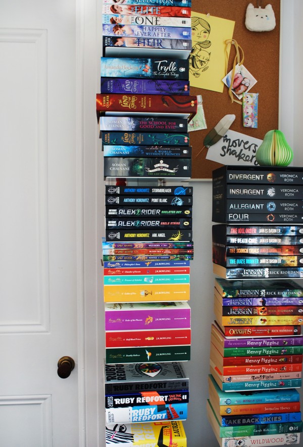 Vertical bookshelves are just one of the clever storage ideas in this tiny teenage bedroom