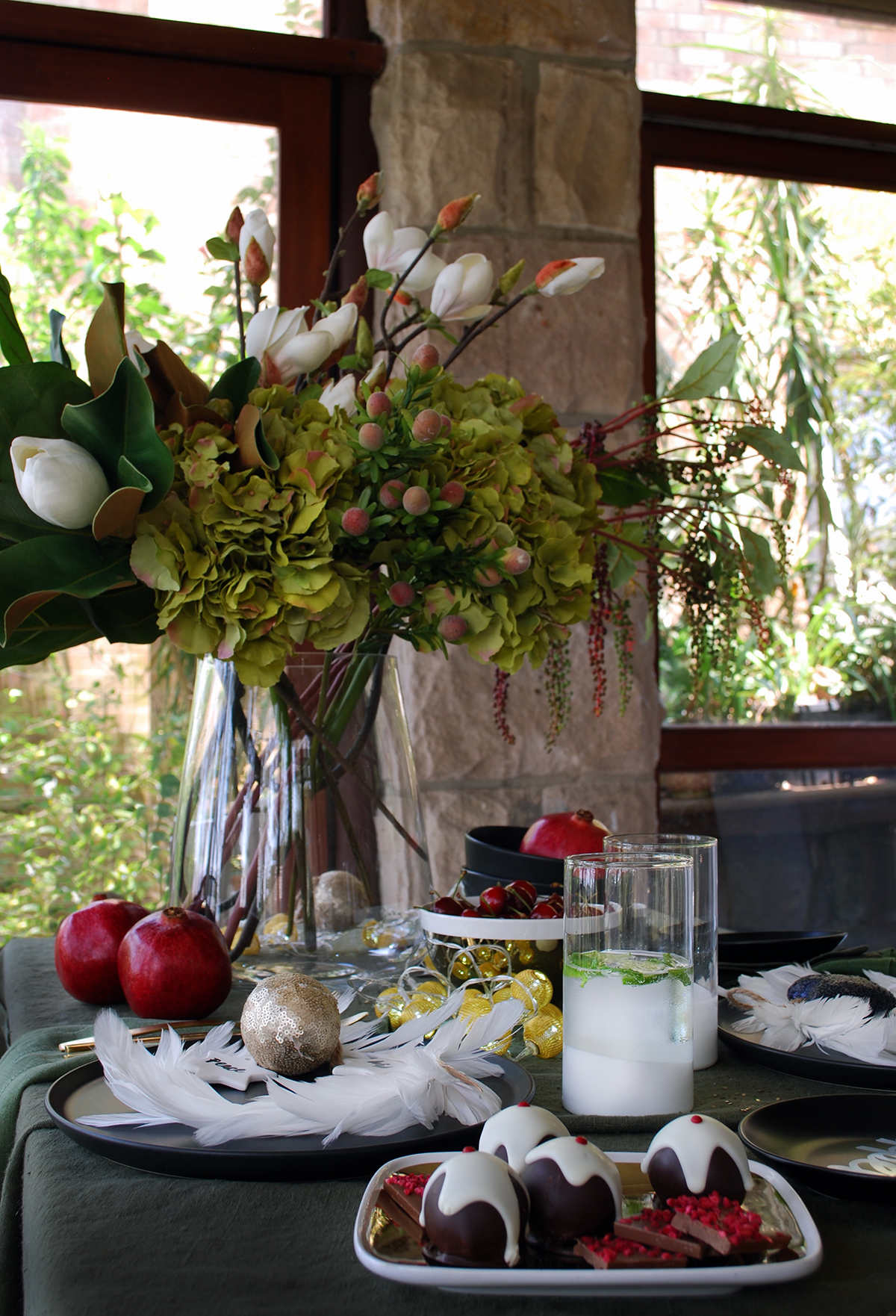 How to style a black Christmas table setting. Add white and gold, rich red and dark olive for a sophisticated palette.