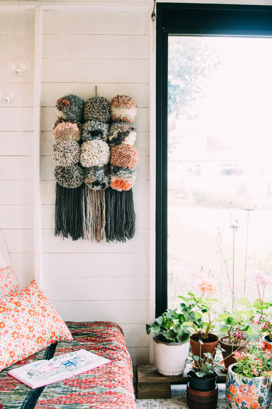 How to make a pom pom wall hanging. Tutorial by Lisa Tile for We Are Scout. Photo by Jeska Hearne of Lobster and Swan