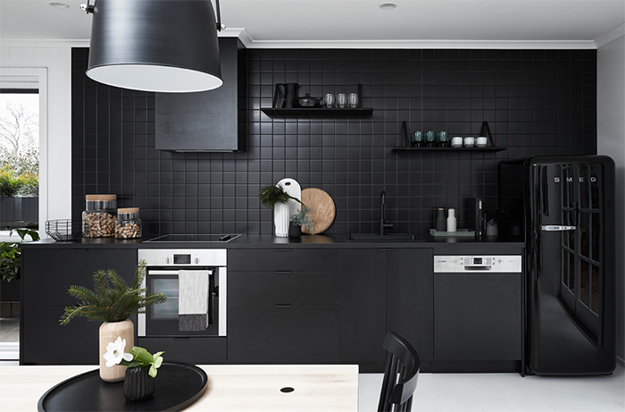 All black kitchen in a monochromatic Scandi style holiday home