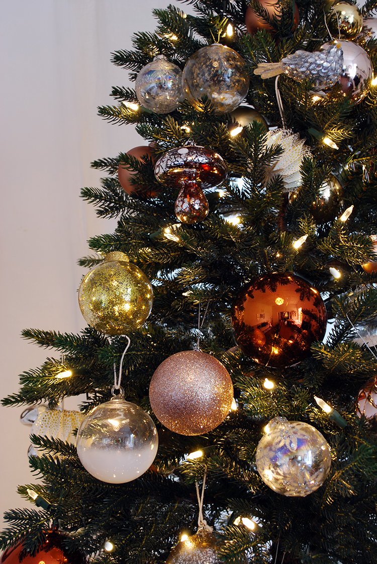 Christmas tree decorations on copper, gold, silver and blush